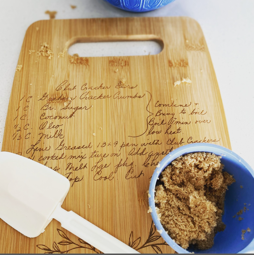 Custom engraved bamboo cutting board with natural wood grain