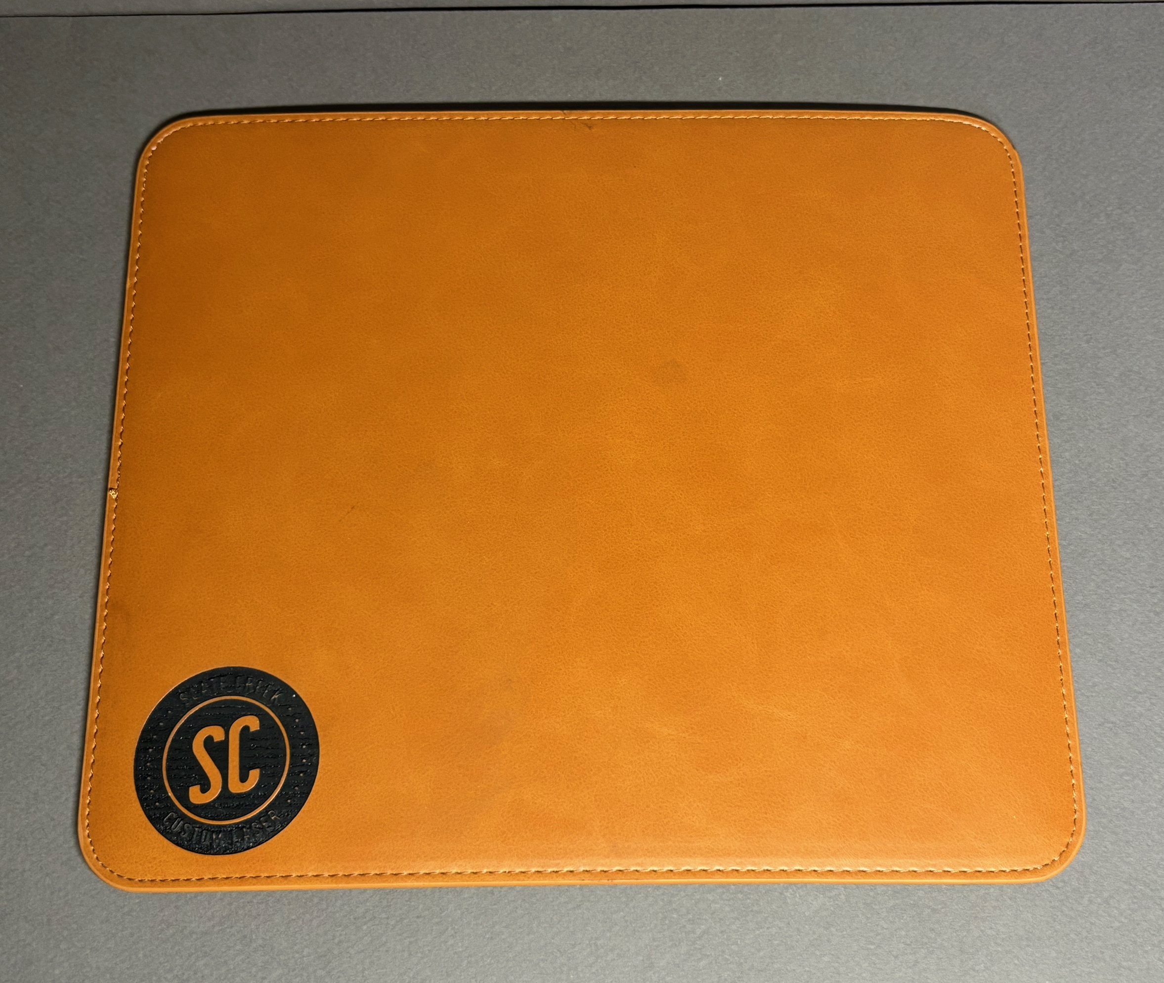 Toffee and black leatherette mouse pad with custom engraving
