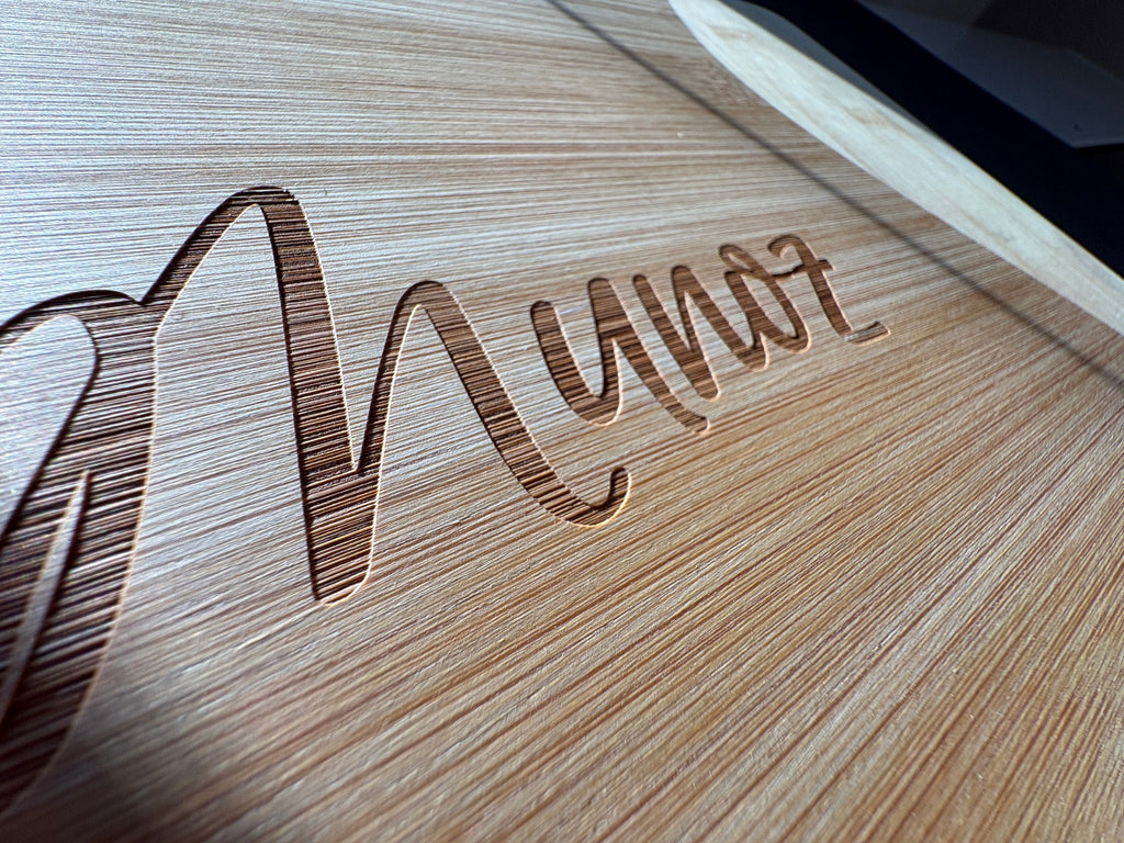 Close-up laser engraved text on bamboo cutting board Quad Cities