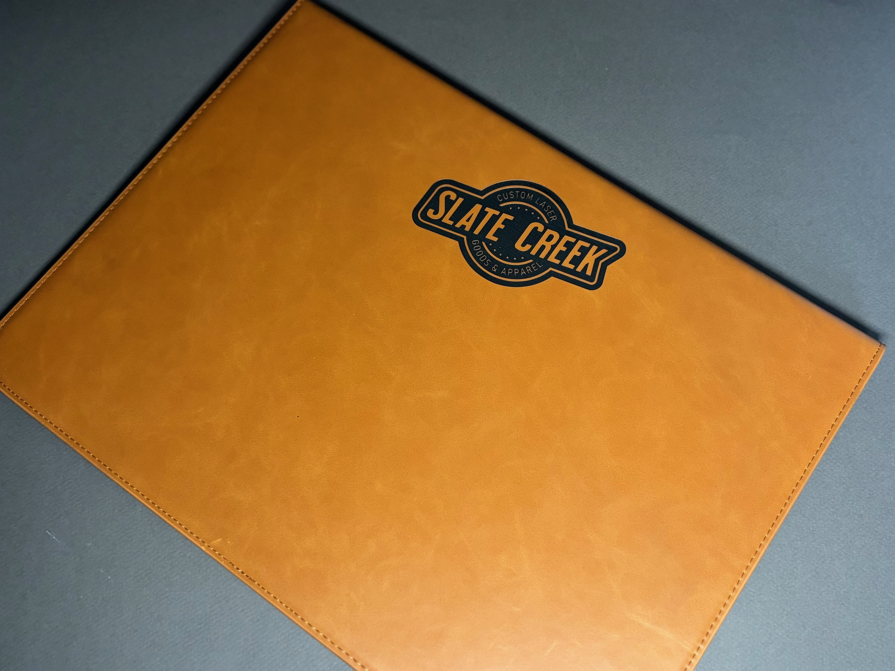 Toffee and black MagFolder padfolio with magnetic closure